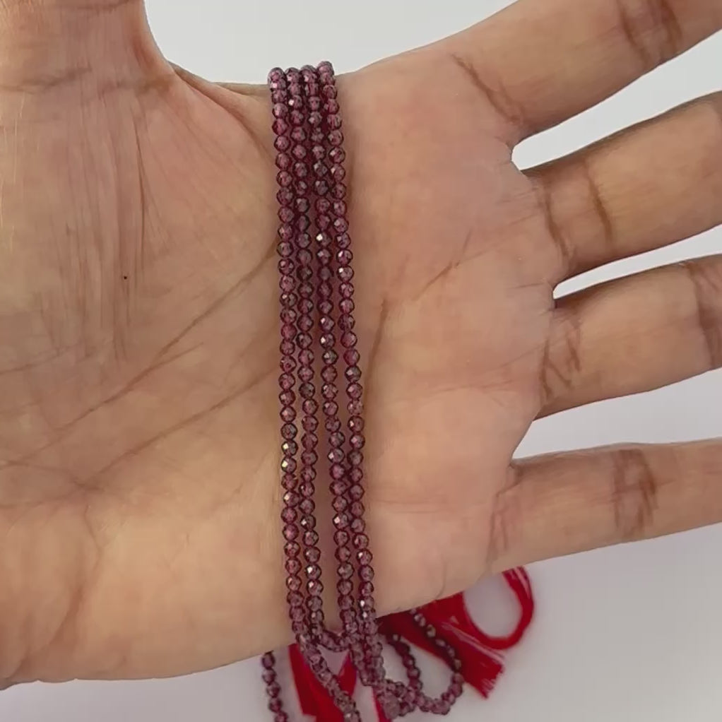 Fine‑cut 2.5mm Garnet rondelle beads with polished facets for jewellery making.