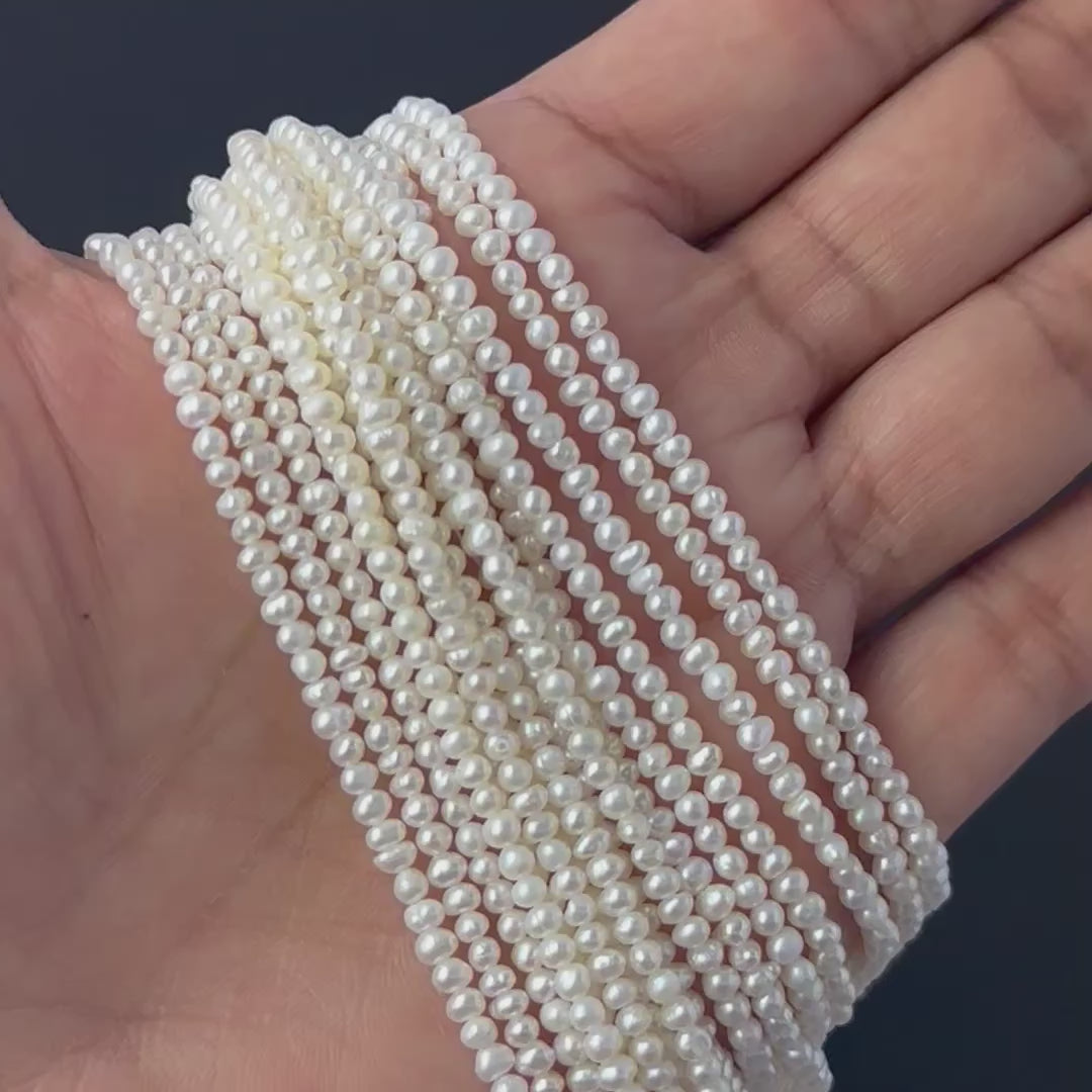 Close‑up of freshwater pearl rondelles showing detailed surface texture and soft pearl sheen.