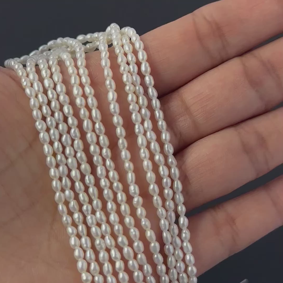 Freshwater rice pearls arranged in a row to showcase their uniform size and smooth finish.