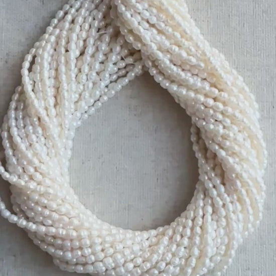 Strand of 4.2 x 5.4mm Baroque Rice Pearls arranged evenly across 40cm with radiant polish.