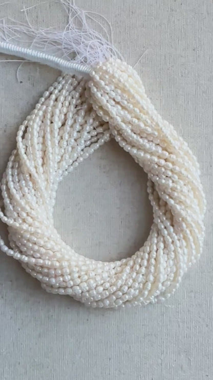 Strand of 4.2 x 5.4mm Baroque Rice Pearls arranged evenly across 40cm with radiant polish.