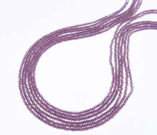 Natural quartz stone beads arranged in loops with subtle sparkle and clarity.