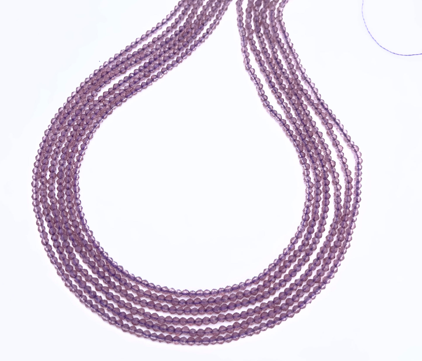 Quartz gemstone beads for DIY jewellery displayed with soft lighting and texture.