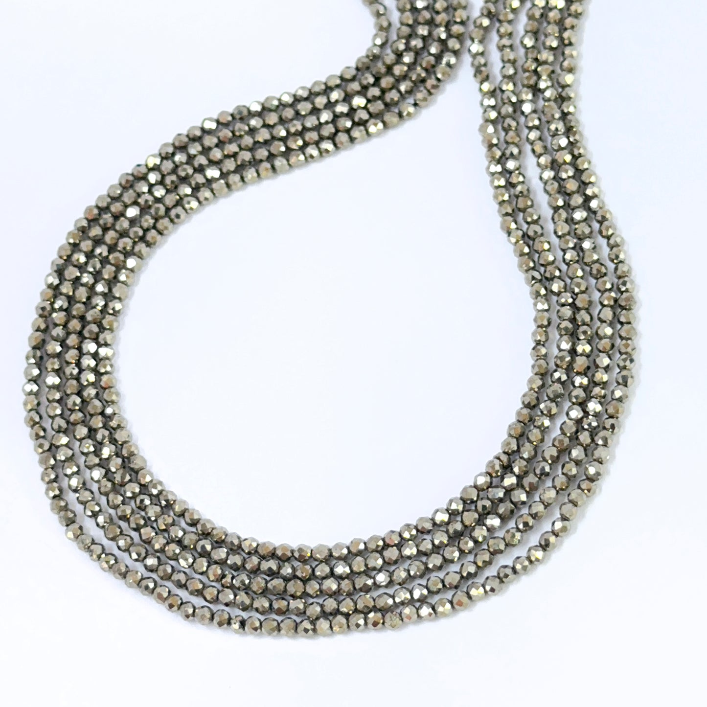 Natural Pyrite faceted rondelles showing metallic shine and crisp gemstone cuts.