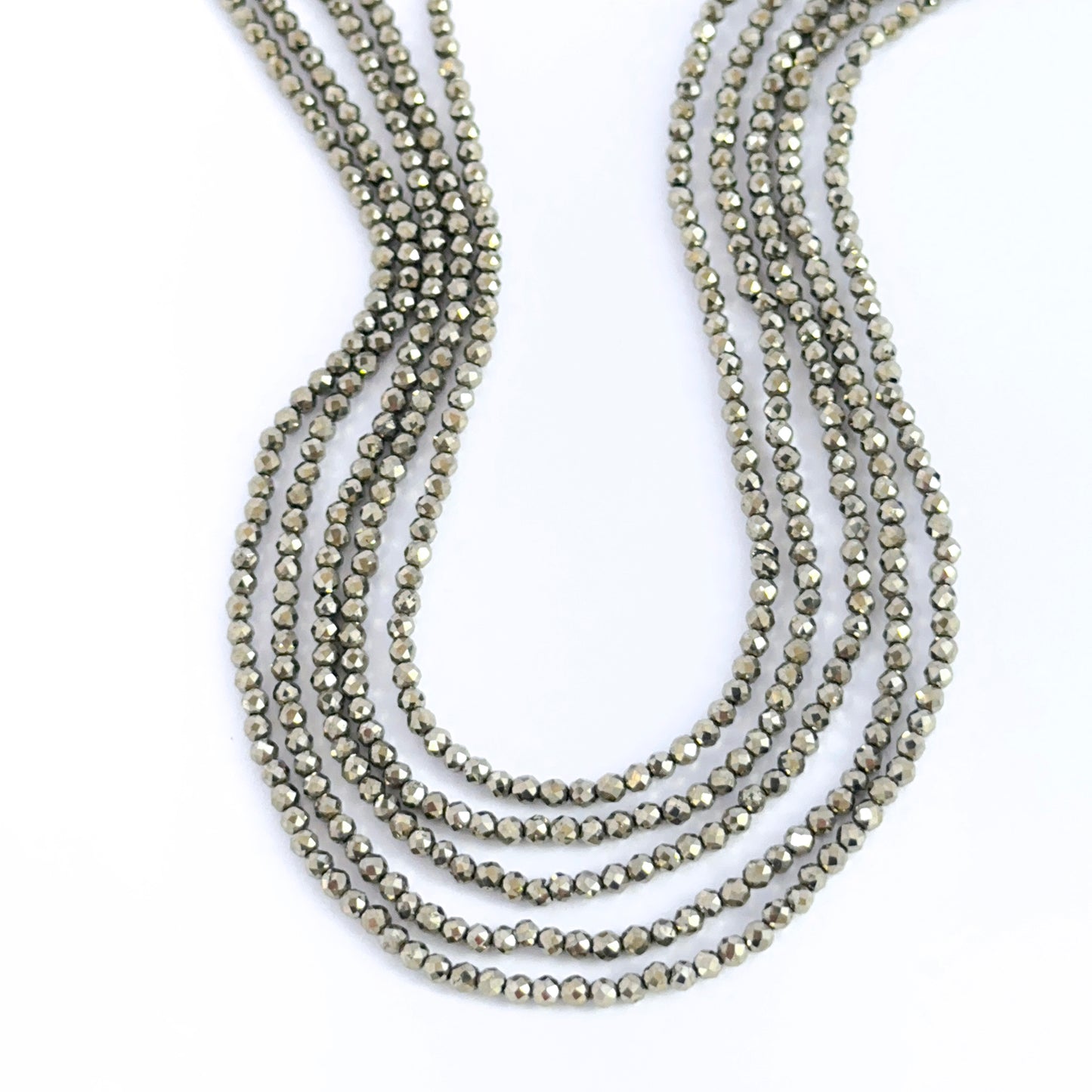 Hand‑selected Pyrite rondelles showing sharp facets and metallic lustre.