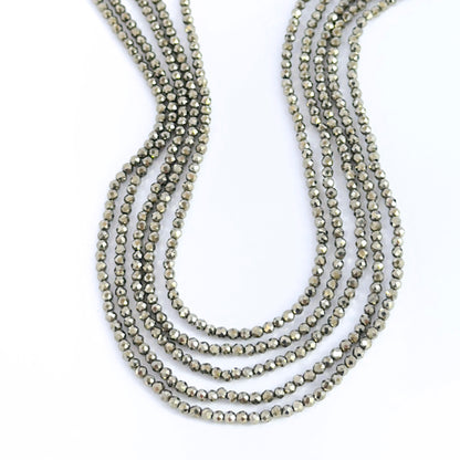 Hand‑selected Pyrite rondelles showing sharp facets and metallic lustre.