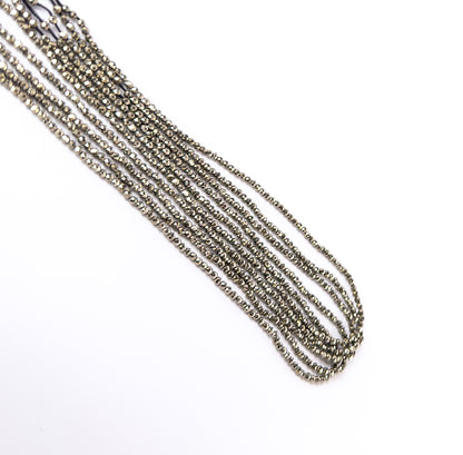 High‑quality Pyrite faceted rondelle beads aligned on a 31cm strand for jewellery crafting projects.