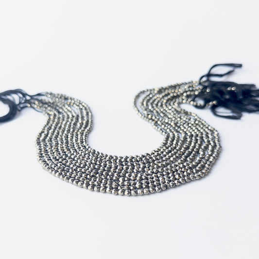 High‑quality Pyrite rondelle beads arranged neatly for gemstone jewellery and beading projects.