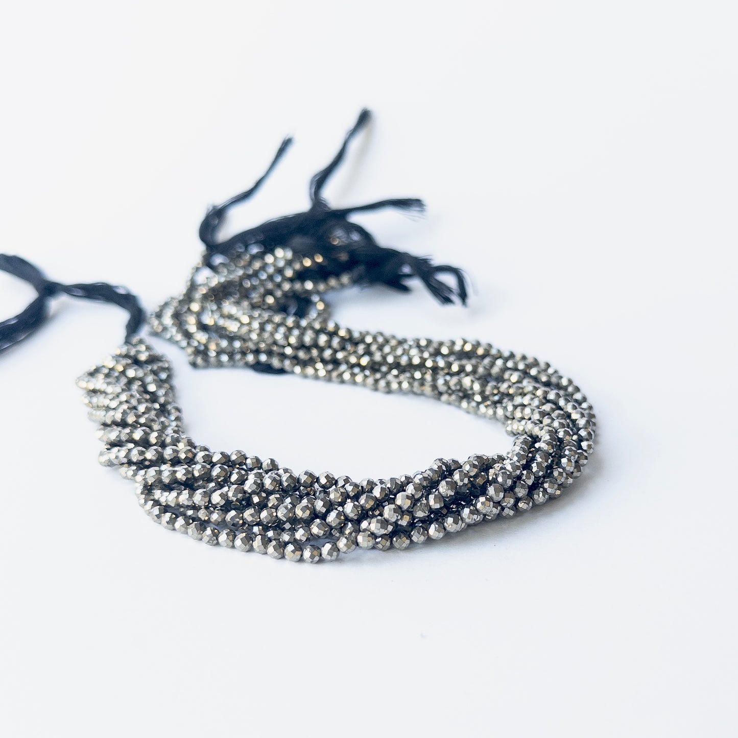 Authentic Pyrite gemstone beads showing natural shimmer and sparkle, ideal for artisan beadwork.