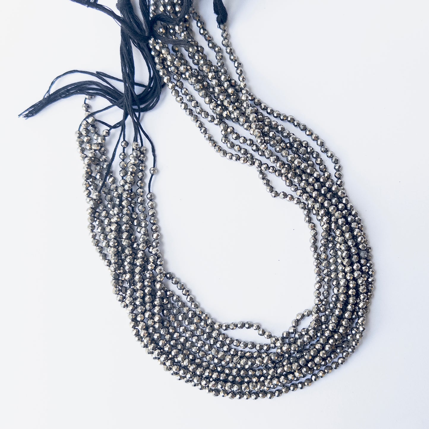 Delicate Pyrite faceted rondelles showcasing shine and clarity for DIY gemstone jewellery designs.