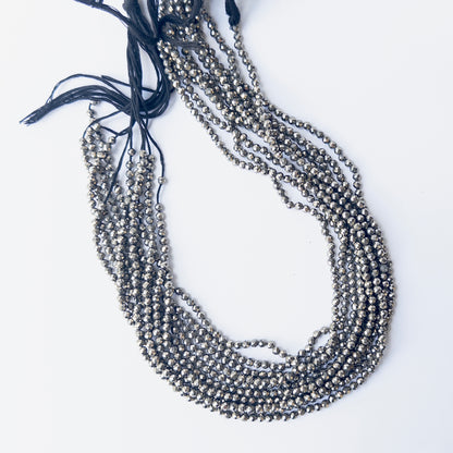 Delicate Pyrite faceted rondelles showcasing shine and clarity for DIY gemstone jewellery designs.