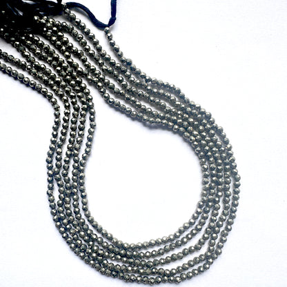 A strand of faceted pyrite rondelle beads with metallic shine and smooth 3mm cut.