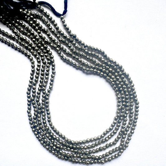 A strand of faceted pyrite rondelle beads with metallic shine and smooth 3mm cut.