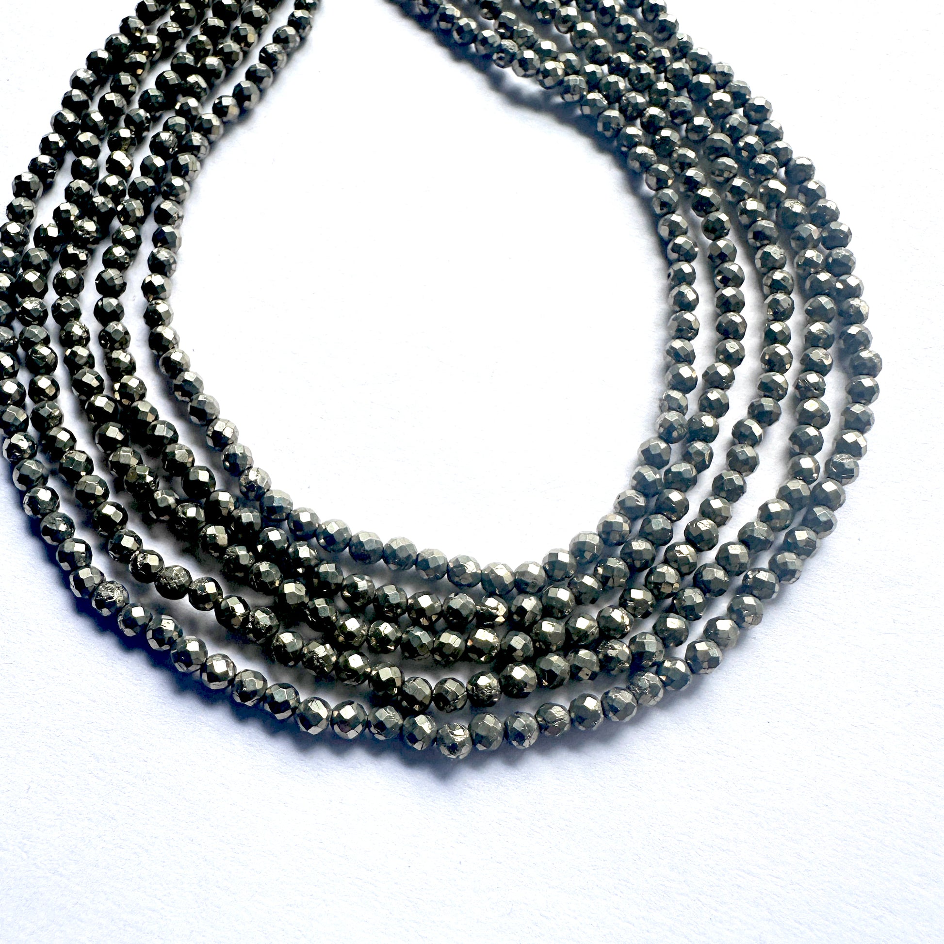 Pyrite beads with 0.4mm holes, ideal for fine jewellery threading and design.