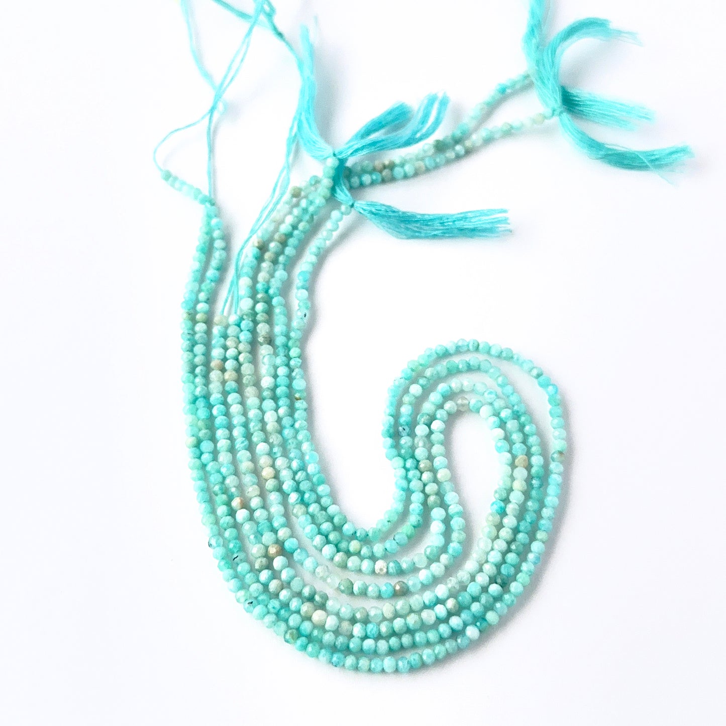 Close view of Amazonite faceted rondelle beads showing cut, clarity and premium gemstone quality.