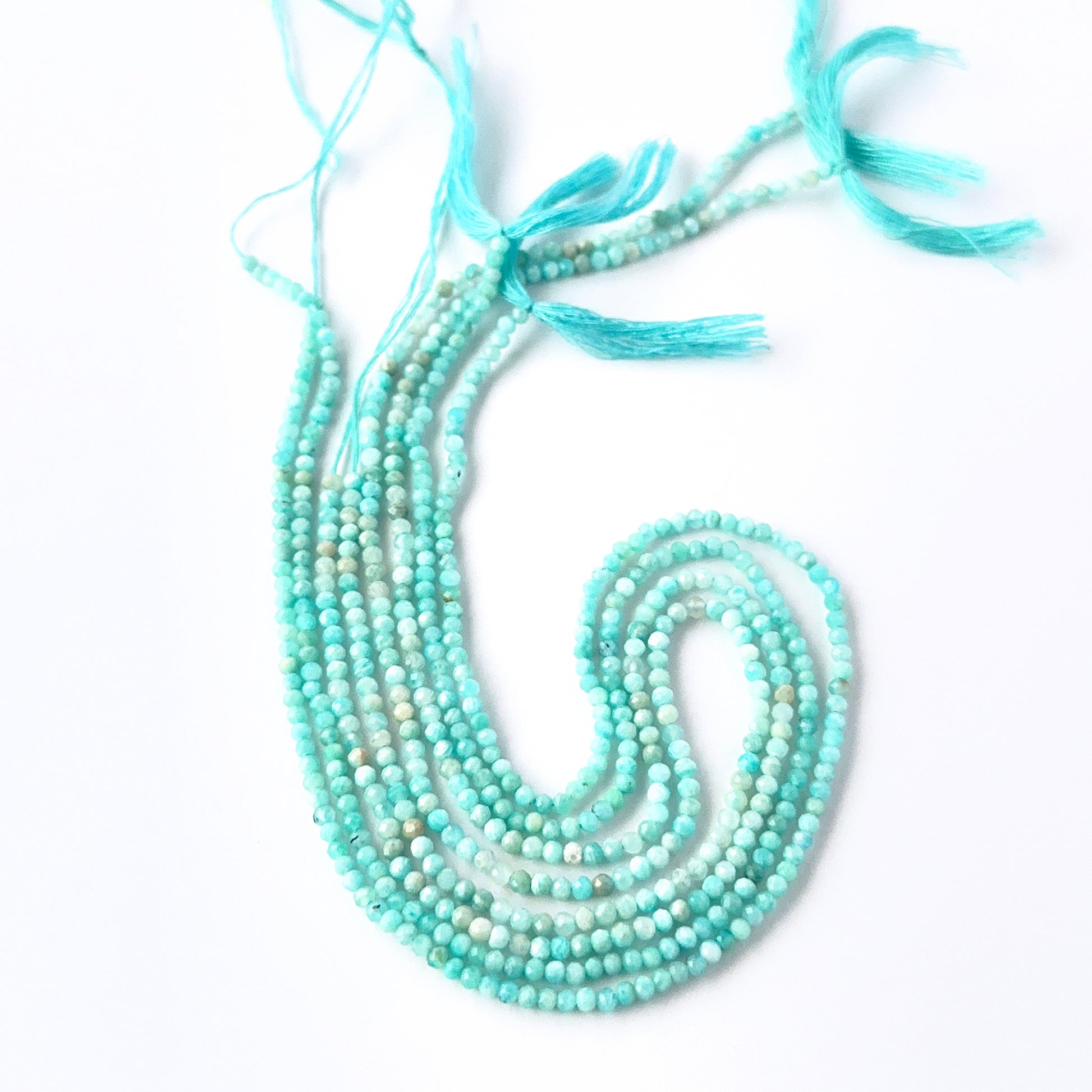 Close view of Amazonite faceted rondelle beads showing cut, clarity and premium gemstone quality.