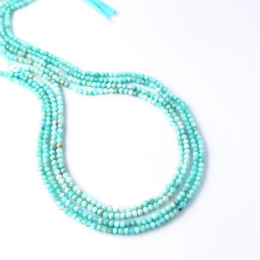 sparkle.
Faceted rondelle Amazonite beads arranged neatly, highlighting their polished finish and handmade jewellery component quality.
