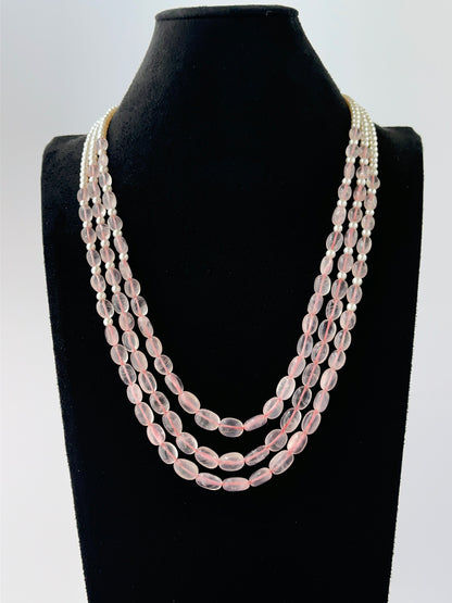 Layered three‑strand necklace crafted from oval quartz and shell pearls, 50–55cm long with adjustable fit.