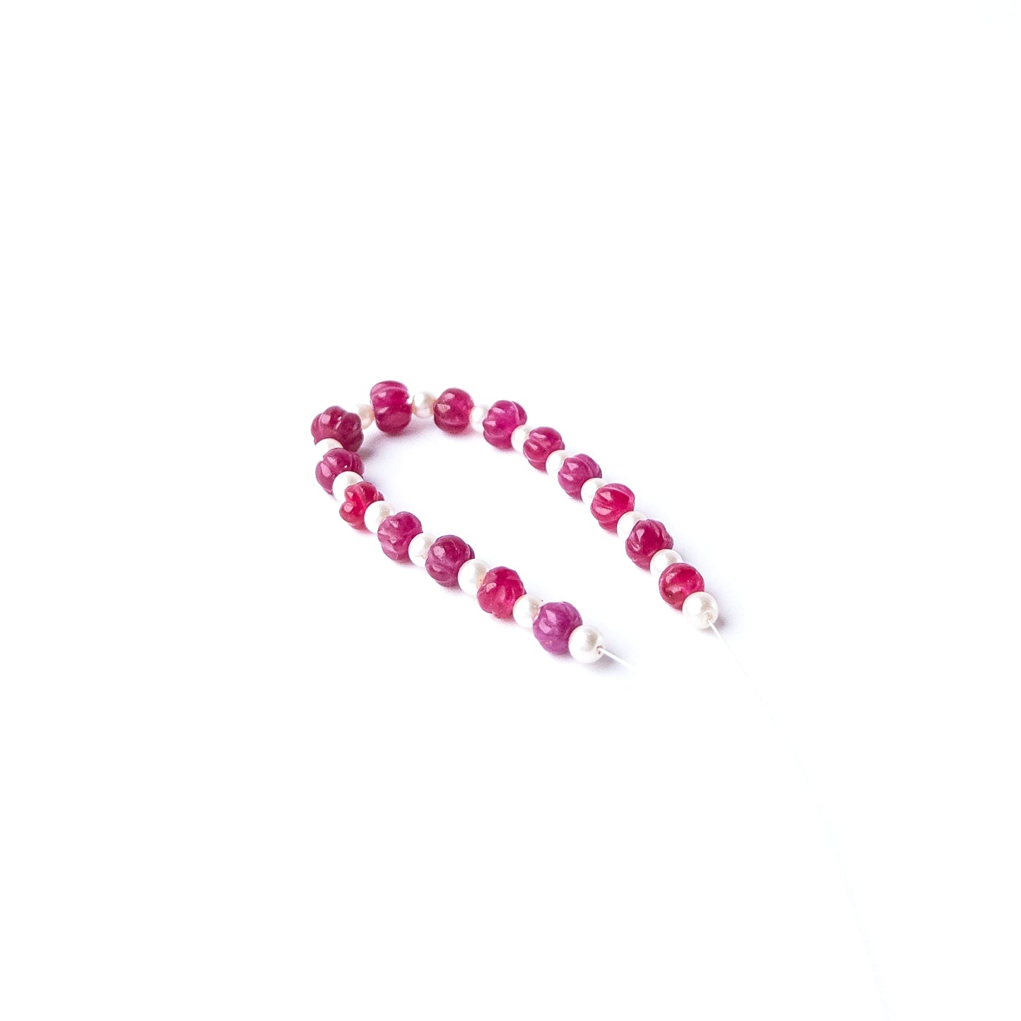 Quartz and Shell Pearl gemstone beads arranged in a mixed set for DIY jewellery designs.