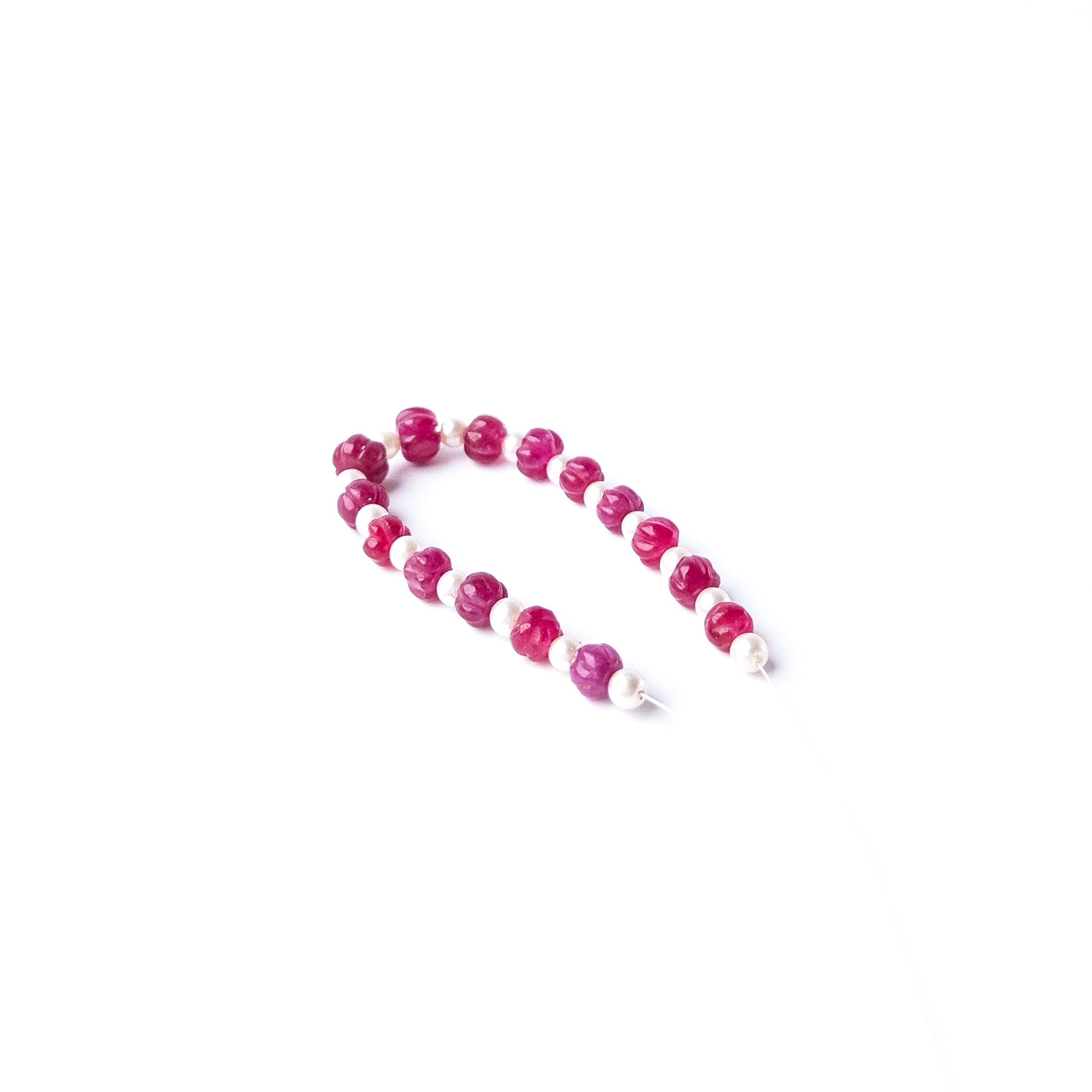 Quartz and Shell Pearl gemstone beads arranged in a mixed set for DIY jewellery designs.