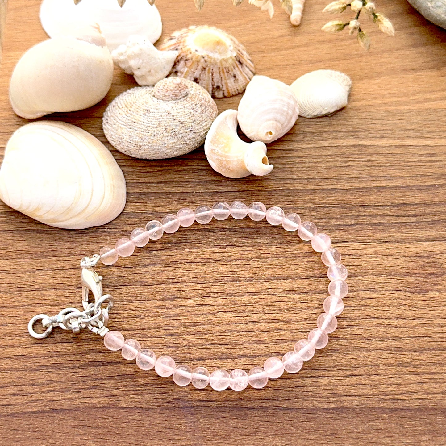 Quartz bracelet featuring smooth round beads with clear polished shine.
