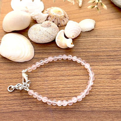 Quartz bracelet featuring smooth round beads with clear polished shine.