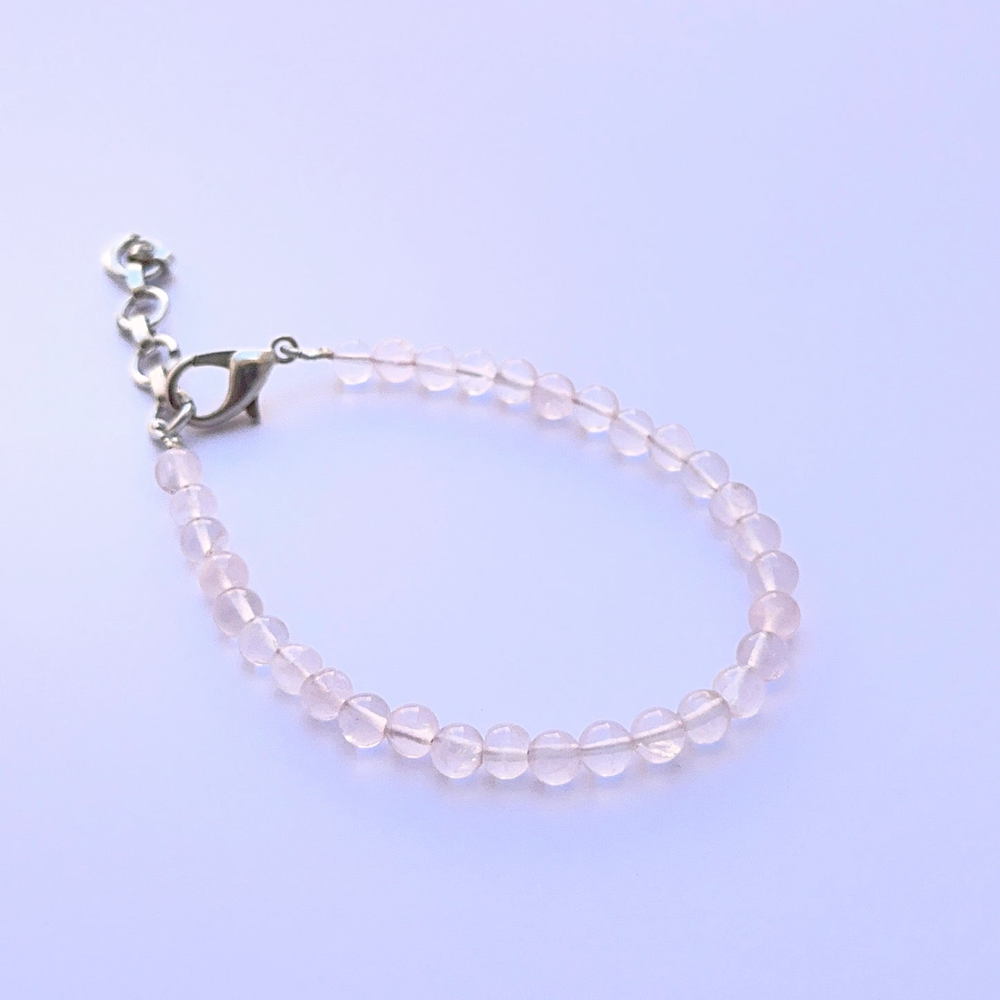 Quartz bracelet with round beads showing natural clarity and brightness.