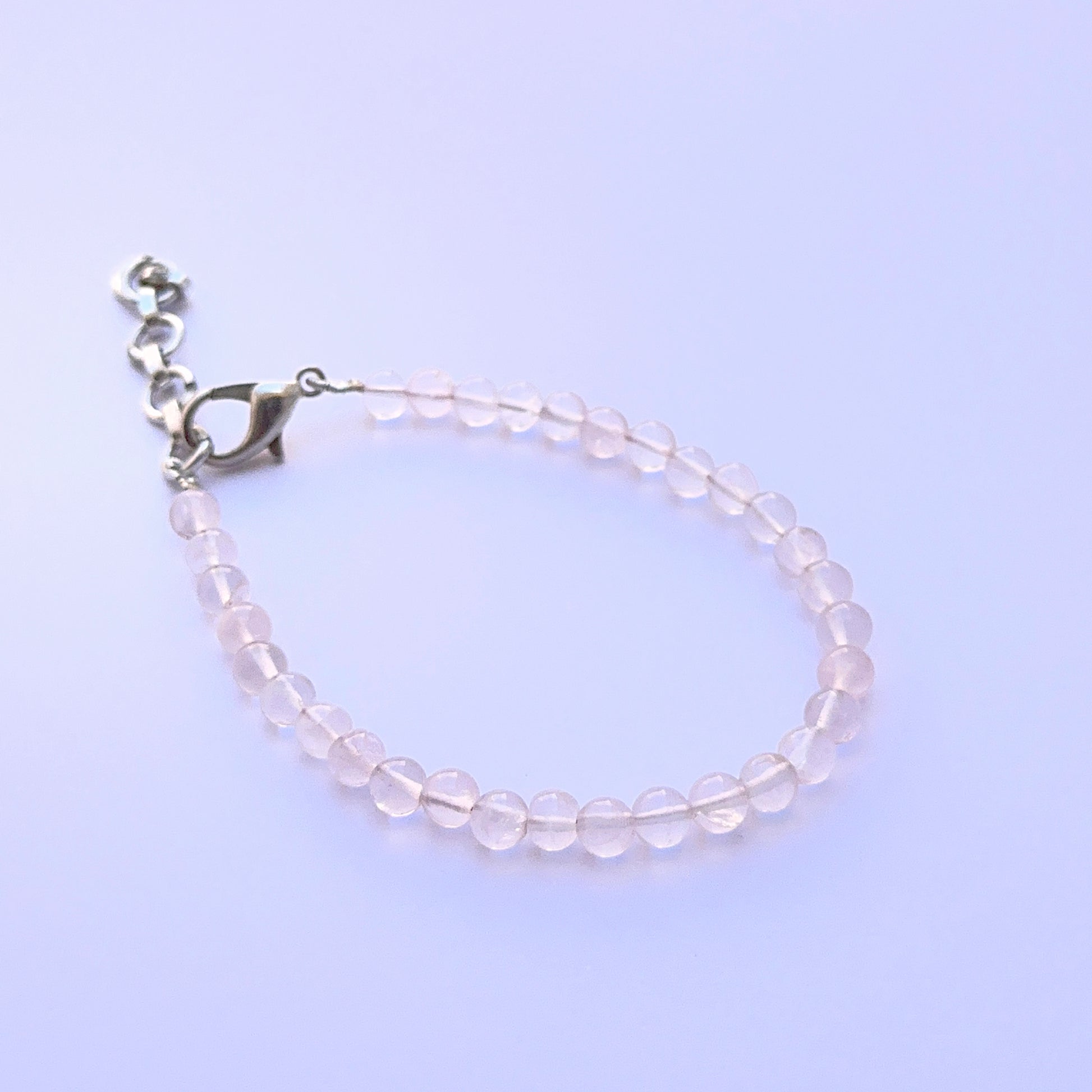 Quartz bracelet with round beads showing natural clarity and brightness.
