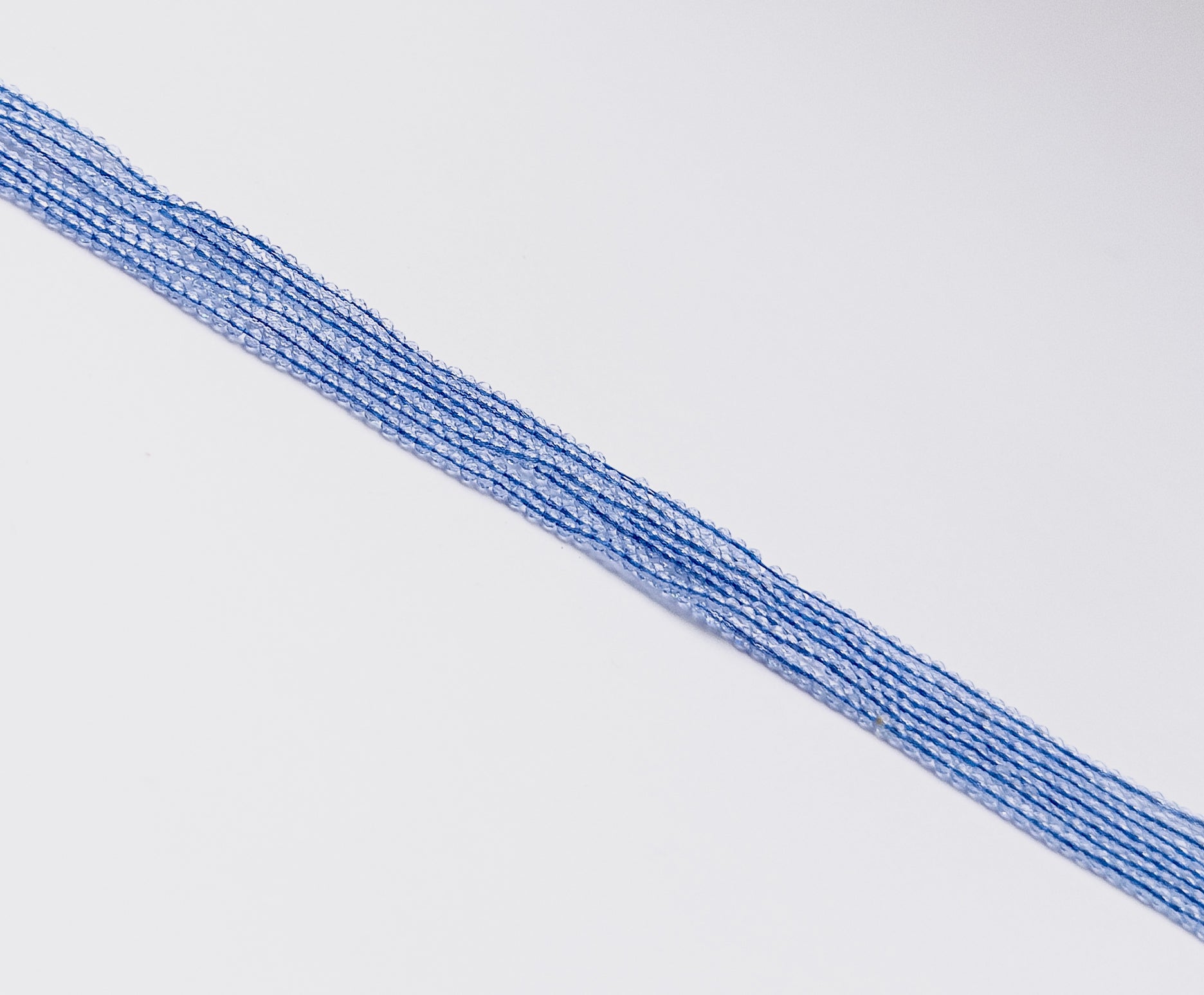 Faceted Quartz rondelle beads showing polished surfaces and elegant gemstone sparkle.


