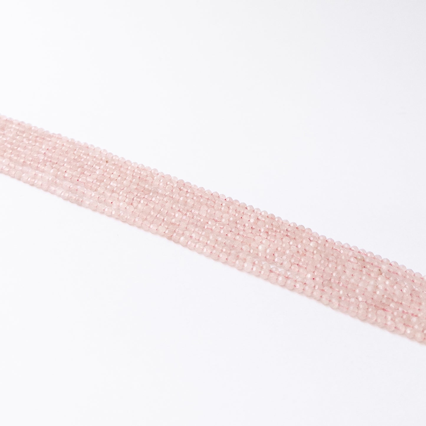 Handmade jewellery components featuring natural Quartz faceted rondelles, highlighting their bright clarity and polished finish.