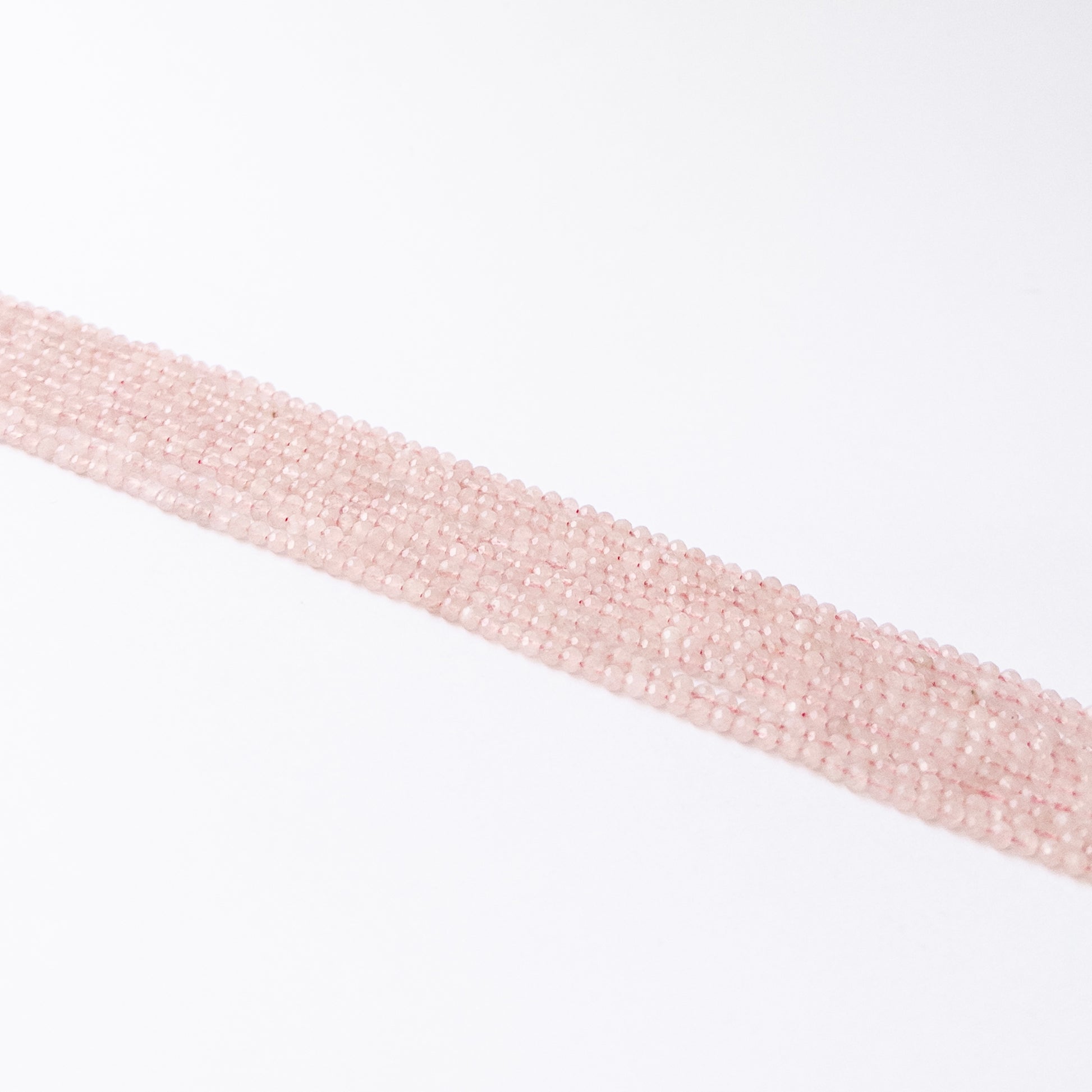 Handmade jewellery components featuring natural Quartz faceted rondelles, highlighting their bright clarity and polished finish.