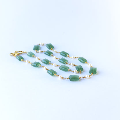 Close up of Quartz and Freshwater Pearl beads showing polished surfaces and elegant soft tones for crafting.