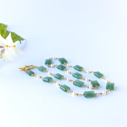 delicate strands of Quartz and Freshwater Pearls beads, showcasing their smooth rectangle design and sparkle