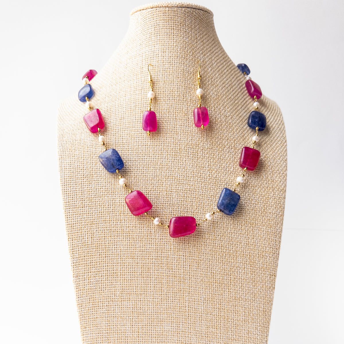 Strawberry Quartz gemstone necklace and earring set offering a graceful blend of rosy hues and pearl lustre.