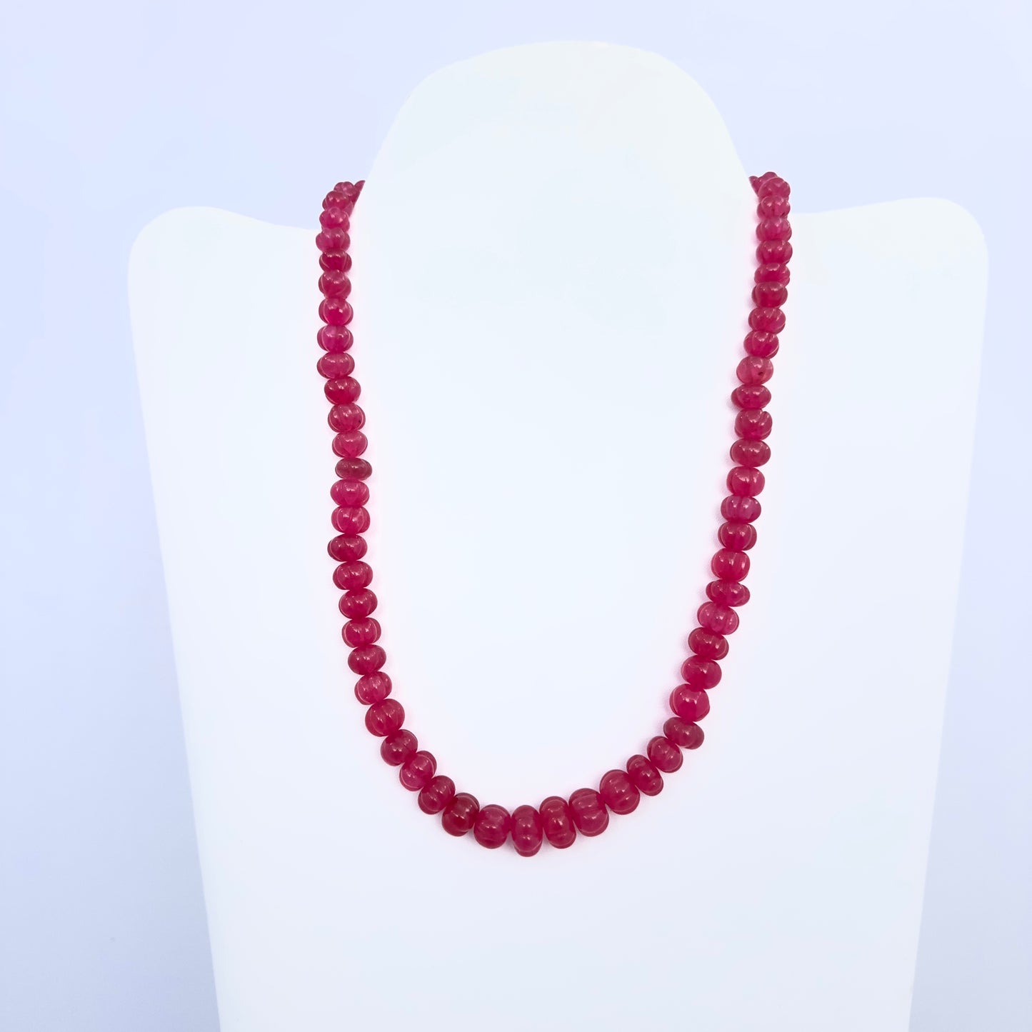 Stone beads necklace featuring 331 carats of melon-cut Quartz in vibrant reddish hues.