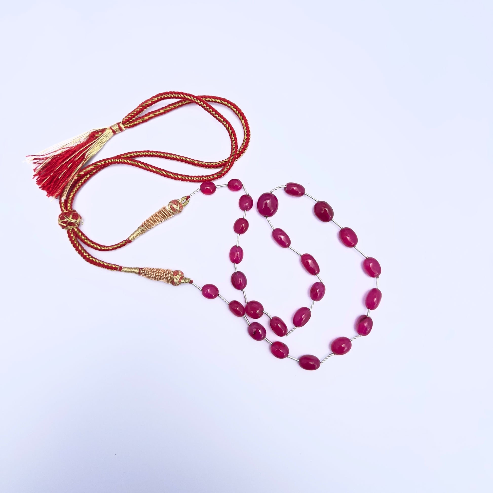 Stone beads necklace featuring 130 carats of smooth oval Quartz in rich reddish hues.
