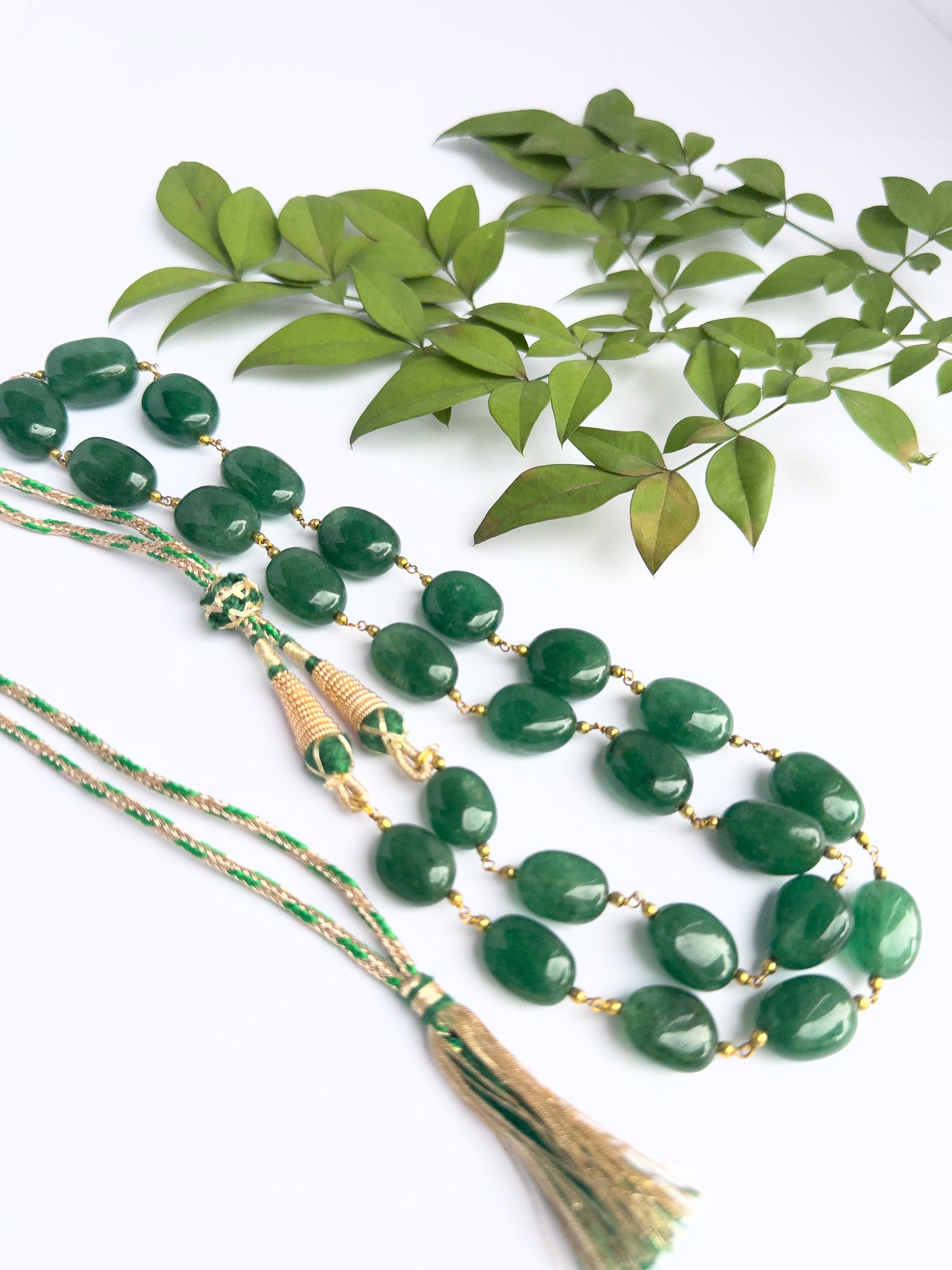 Close-up of quartz gemstone beads, tumble cut, polished finish, arranged in strand