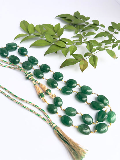 Close-up of quartz gemstone beads, tumble cut, polished finish, arranged in strand