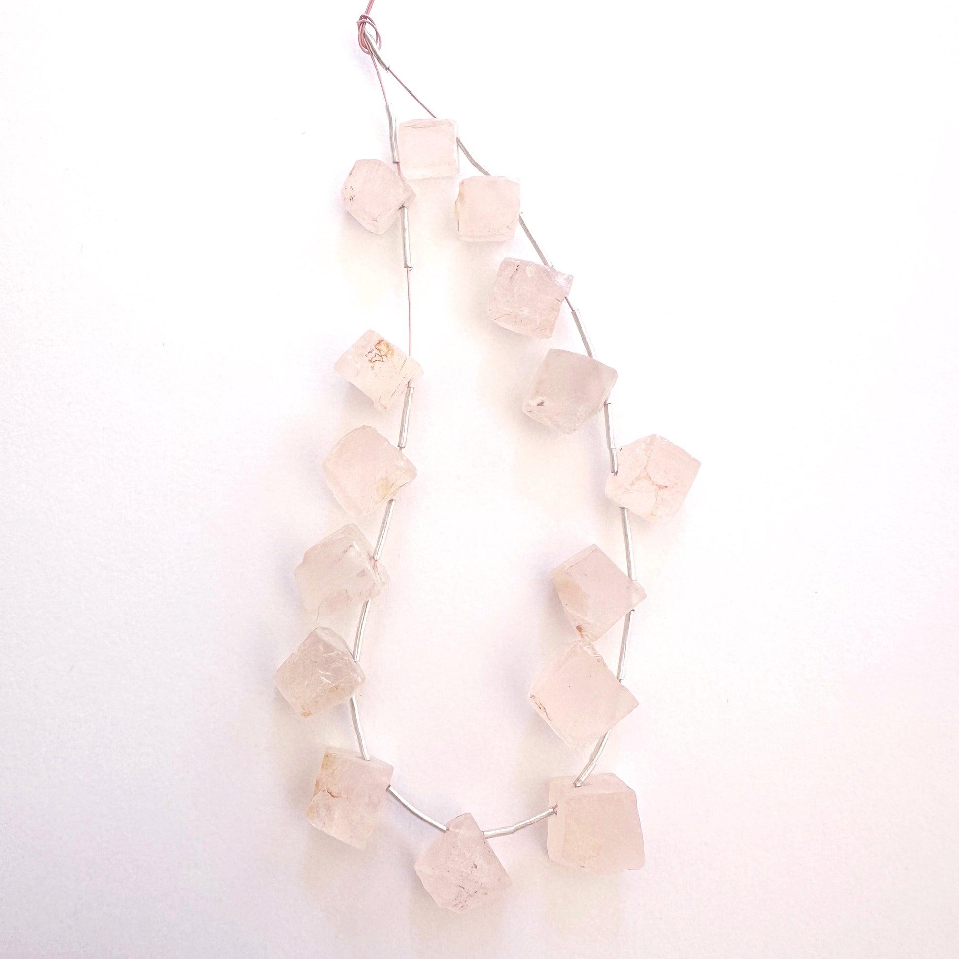 Detailed view of Quartz rough gemstones with varied shapes and clean drill holes.