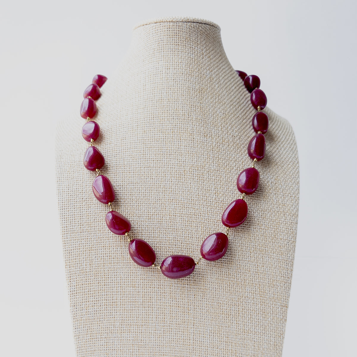 Quartz smooth tumble gemstone necklace featuring polished freeform beads in vibrant pink tones with a bold and elegant statement design.