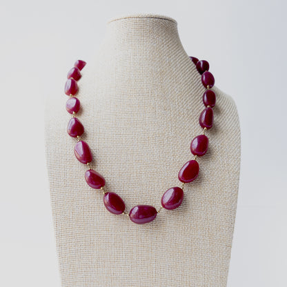 Quartz smooth tumble gemstone necklace featuring polished freeform beads in vibrant pink tones with a bold and elegant statement design.