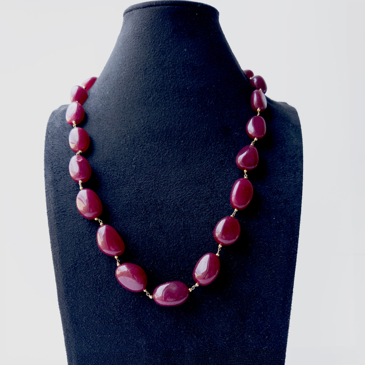 Genuine Quartz gemstone jewellery displaying rich raspberry pink hues and beautifully polished organic bead shapes.