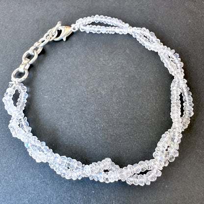 Elegant rainbow moonstone bracelet crafted from natural gemstone beads, 3mm faceted rondelles, adjustable 17.5cm length.