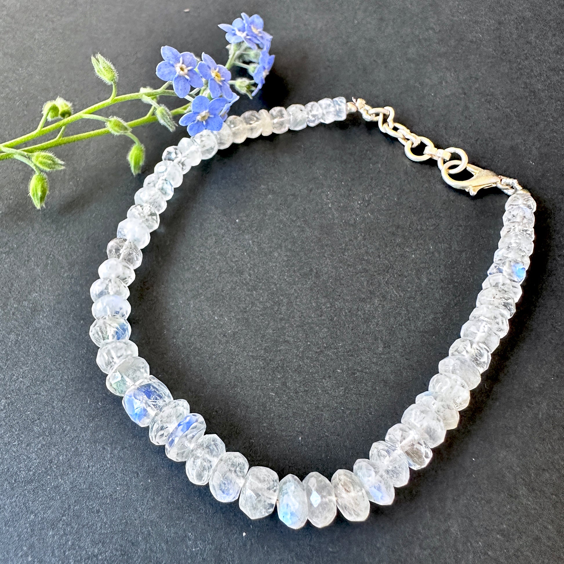 Rainbow moonstone bracelet with natural gemstone beads, faceted rondelle cut 5–6.5mm, 20cm length, 51 carats.