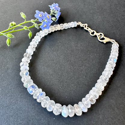 Rainbow moonstone bracelet with natural gemstone beads, faceted rondelle cut 5–6.5mm, 20cm length, 51 carats.