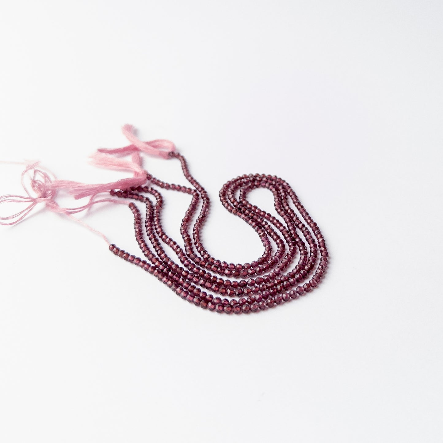 Rhodolite Garnet rondelle stone beads offering rich colour and shine for premium jewellery crafting.