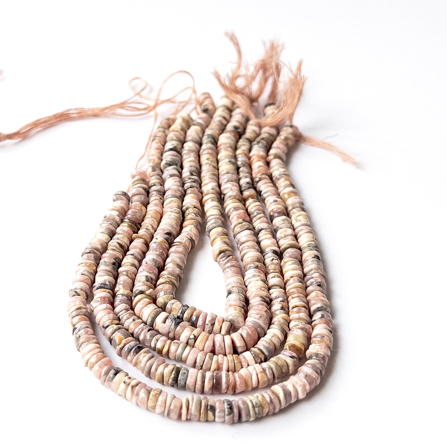 Authentic Rhodonite smooth wheel gemstone beads ideal for DIY jewellery and handmade beaded designs.