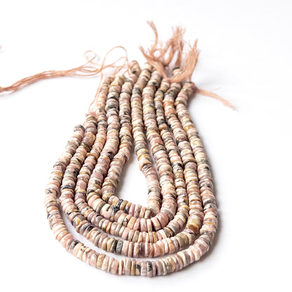 Authentic Rhodonite smooth wheel gemstone beads ideal for DIY jewellery and handmade beaded designs.