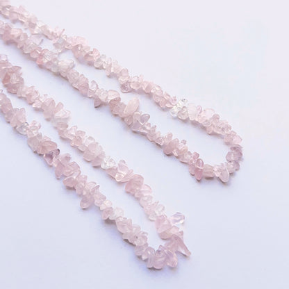 Close-up of natural gemstone beads highlighting the pink hue and handcrafted quality.