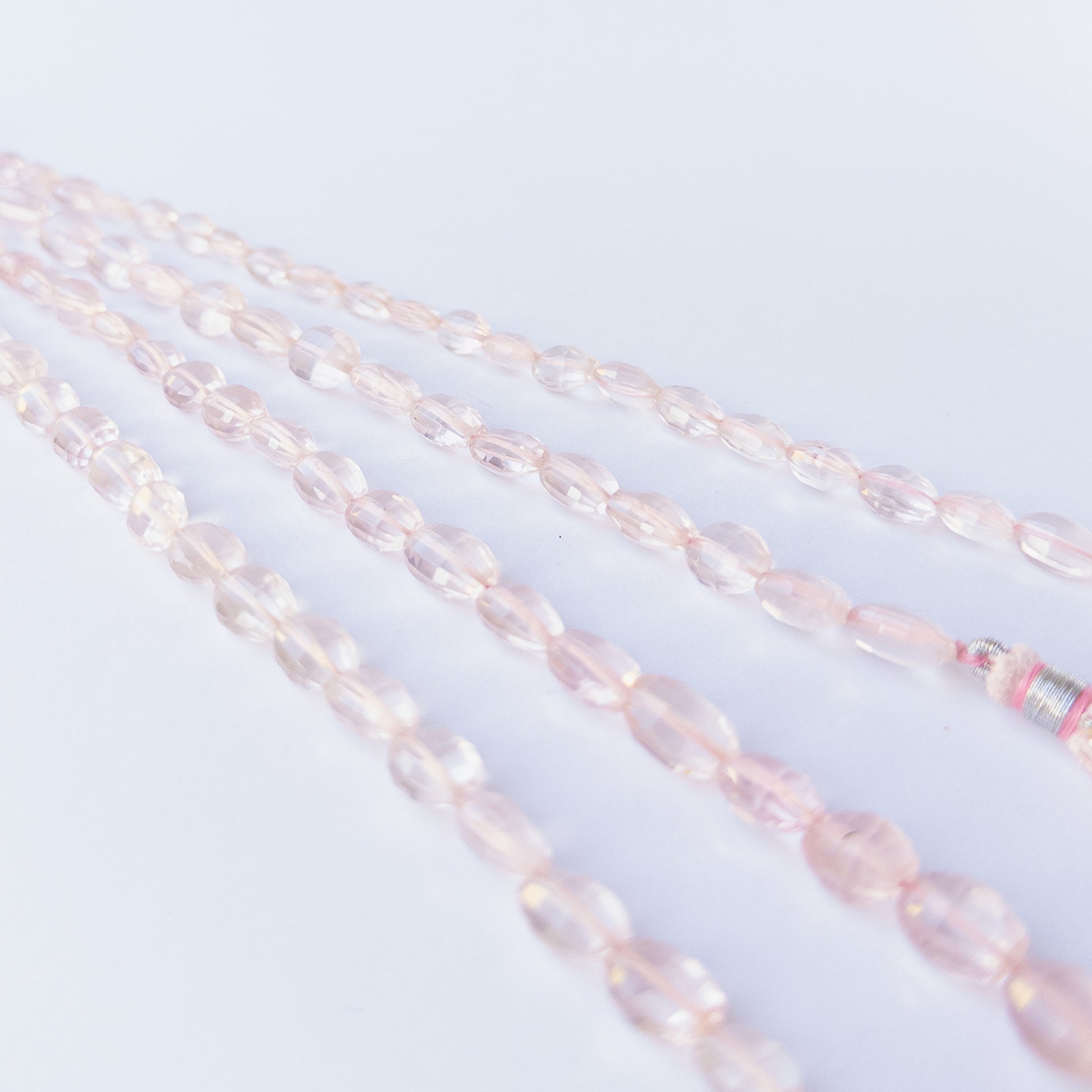 Genuine Rose Quartz gemstone beads with faceted oval cut perfect for artisan jewellery designs.